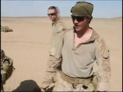 US troops on patrol, injured boy, aid distribution News Clip