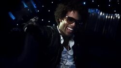 Hip-hop star in limousine laughs as cameras flash outside at awards show Stock Footage