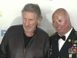 Roger Waters (center), Staff Sgt. Robert Henline U.S. Army, NYCF, Veterans Airlift Command and guests at The 6th Annual Stand Up For Heroes Presented by The New York Comedy Festival and The Bob Woodruff Foundation Stock Footage