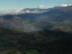 AERIAL Through clouds to patchwork valley and Lac de Serre-Poncon/ Alpes-Maritimes, France Stock Footage