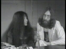 John Lennon and Yoko Ono interview on 'howling' Stock Footage