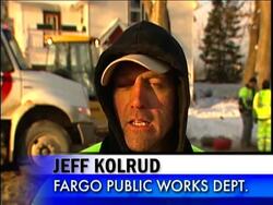 The bloated Red River briefly breached a dike early Sunday, pouring water into a school campus and the mayor called it a "wakeup call" for a city that needs to be vigilant for weaknesses in levees that could give way at any time. News Clip