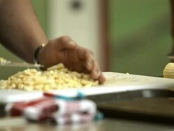 Someone cuts the corn from the cob Stock Footage