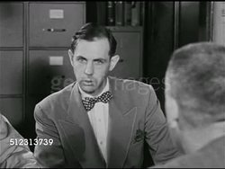 1951: EMERGENCY PREPAREDNESS: DRAMATIZATION: 'Colonel' asking to see radio set-up. City official walking w/ 'Colonel' to building. Men in Radio Communications room. Civil Defense Plan, The Red Scare, McCarthyism. Instructional Video