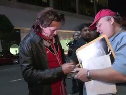 Michael Madsen on Man sitting on whale carcass with massive shark swarming at Mr Chow in Beverly Hills Stock Footage