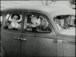 Motorists carpool to work and buy gas with gas stamps. News Clip