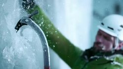 SLO MO ice climber swinging the axe to ascend Stock Footage