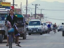 MS Shot of Crowded road in city /  Vang Vieng, Vientiane, Laos Stock Footage