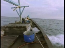 MS bow of fishing boat splashing through waves, Malaysia Stock Footage
