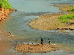MS Shot of people playing in khan river / Luang Prabang, Laos Stock Footage