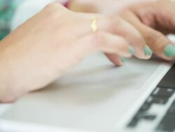 Woman using laptop computer Stock Footage