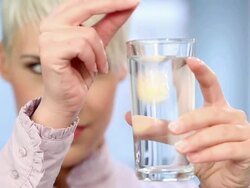 Young woman with fizzy tablet Stock Footage