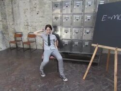 Young woman sitting in classroom and throwing paper airplane Stock Footage