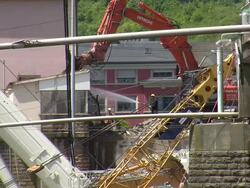 WS Worker working at deconstruction of bridge over river Mosel / Wellen, Rhineland Palatinate, Germany Stock Footage