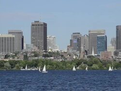 WS View of city located near river and sailling boats moving on river / Boston, Massachusetts, United States Stock Footage