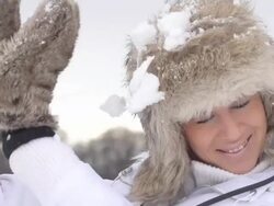 HD SUPER SLOW-MO: Woman Defending From Snowballs Stock Footage