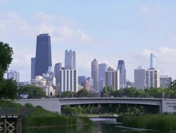 WS Chicago skyline with park and pond Stock Footage