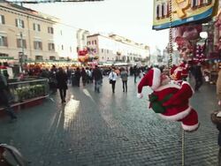 MS Shot of figurines Santa Claus and other typical characters attract people shopping / Rome, Italy Stock Footage