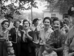 B/W 1950s pro-segregation women protesting + clapping outside of segreated school / newsreel Stock Footage