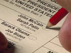2008 CU hand using pencil to vote for John McCain and Sarah Palin on US presidential ballot / pencil moves between choices before deciding Stock Footage
