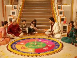 Family preparing rangoli in diwali festival Stock Footage