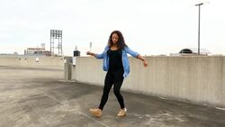 MS ZI Female dancer on rooftop of building with cityscape in background Stock Footage