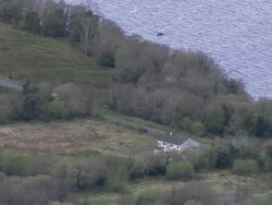 Aerial tracking van driving down rural road, Loch Erne, Northern Ireland Stock Footage