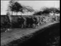 B/W 1910s PAN Allied troops marching on country road into Germany after World War I Stock Footage