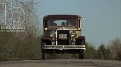 Car driving through the countryside, 1930s - reenactment, clip 7 Stock Footage