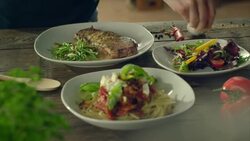 Three different meals on a table Stock Footage