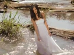 Young woman standing in the water at forest, Athirappilly, Kerala, India Stock Footage