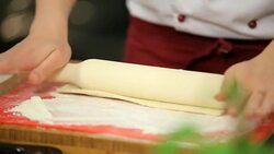rolling dough with a rolling pin Stock Footage