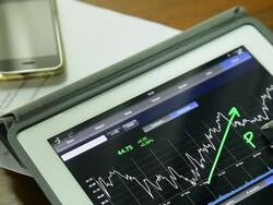 Businessman using Tablet analysis stock data. Stock Footage