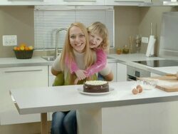 HD DOLLY: Cheerful Mother And Daughter In The Kitchen Stock Footage