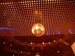HD Ceiling lights with disco ball (tilt up) Stock Footage