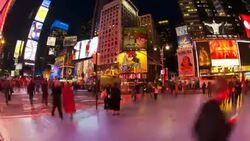 Crowds of people move through Times Square at night. Stock Footage