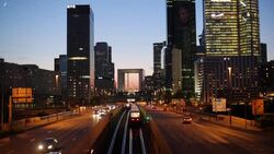 Paris road leading towards La Grand Arche and modern office buildings at La Defense, Paris, France Stock Footage