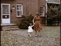 Young mother walks 3 year-old daughter to car Stock Footage