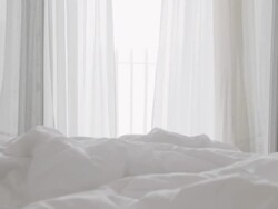 HD DOLLY: Curtains Fluttering In Breeze Stock Footage