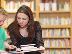 Reading to Elementary Age Child Stock Footage