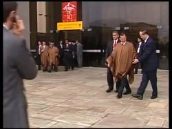 Leaders dress in ponchos for traditional family photo News Clip