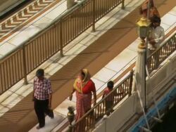 WS PAN TU People walking on walkway at Golden Temple / Amritsar, Punjab, India Stock Footage