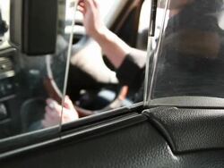 Male Taxi driver handing over receipt to customer Stock Footage
