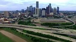Aerial Houston Texas Across Highways and River Skyline Cityscape background Stock Footage