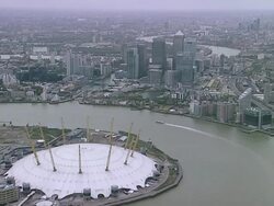 AERIAL WS Canary Wharf and O2 Arena Stock Footage