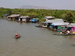 Tonle Sap (Great Lake), houses and ships in the lake Stock Footage