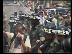 Protest against Bush's visit, demonstrators burn Bush effigies News Clip