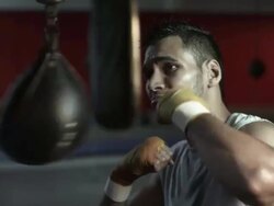 Boxer using punch bag Stock Footage