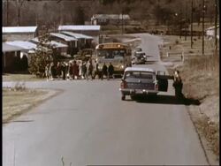 School children run to catch school bus Stock Footage