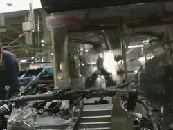 MS Worker installing components on an internal combustion engine in an auto assembly plant / Princeton, Indiana, United States Stock Footage
